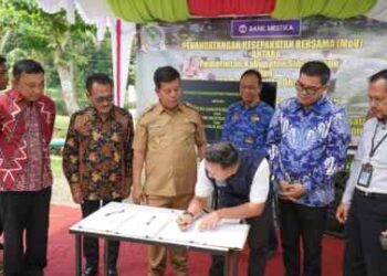 Disaksikan OJK, Pemkab Simalungun-Bank Mestika Dharma-BUMDes Anyar Lestari Tandatangan MoU