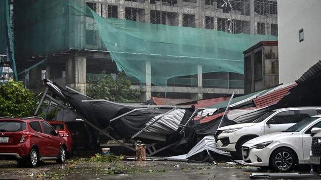 Foto: Vietnam dilanda Topan Super Yagi hingga tewaskan 14 orang dan lukai 176 orang. (AFP/NHAC NGUYEN)